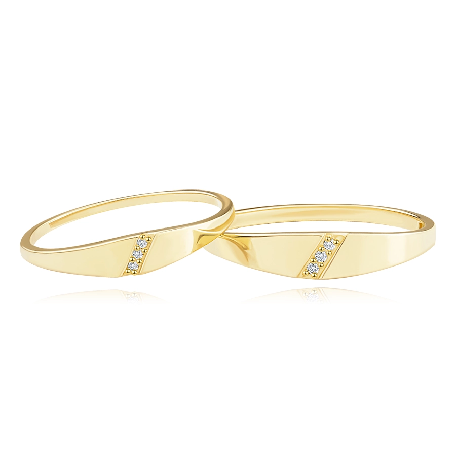 14K yellow gold bands - three clear brilliants in diagonal notch