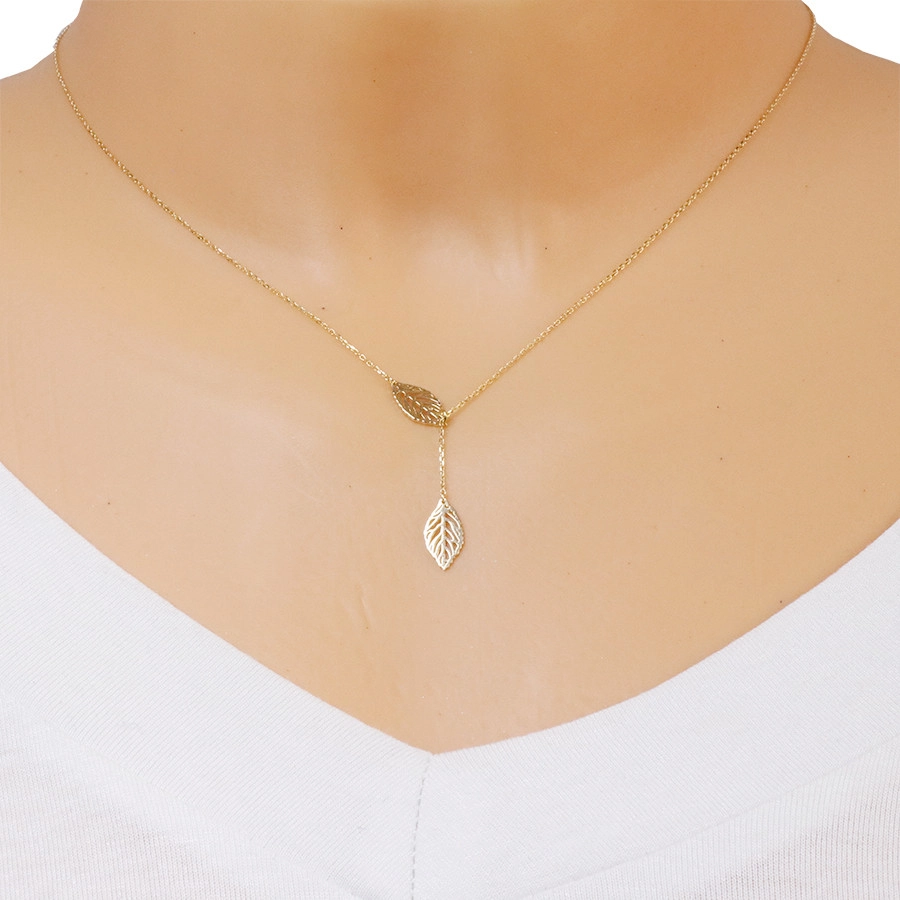 585 Yellow gold necklace – an outline of two dangling leaves with tiny cut-outs
