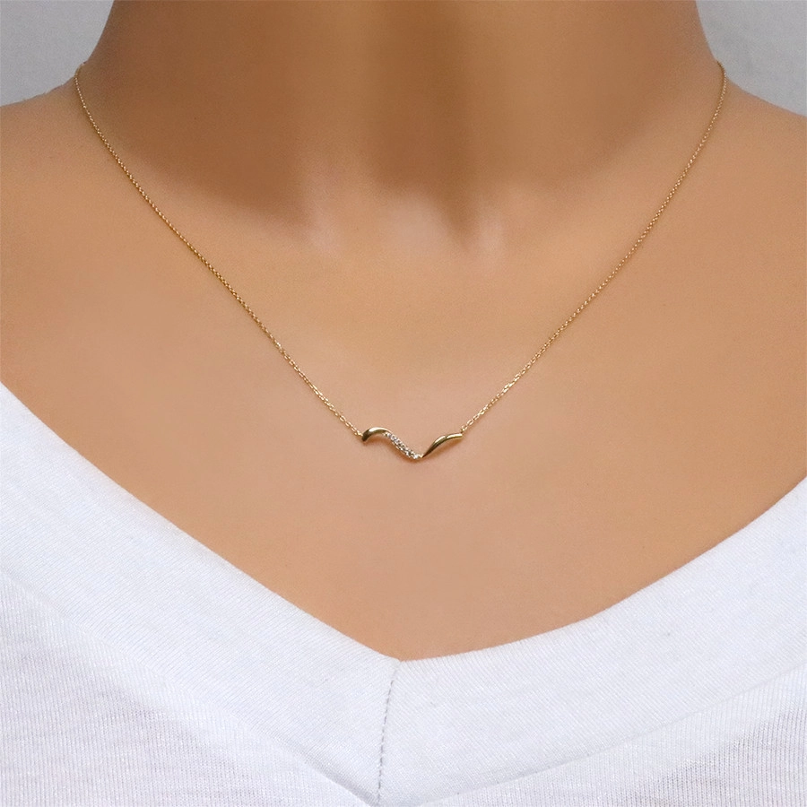 9K Golden necklace – asymmetrical wavy line, clear zircons