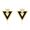Earrings made of yellow 14K gold - black triangle with cutout, clear zircons